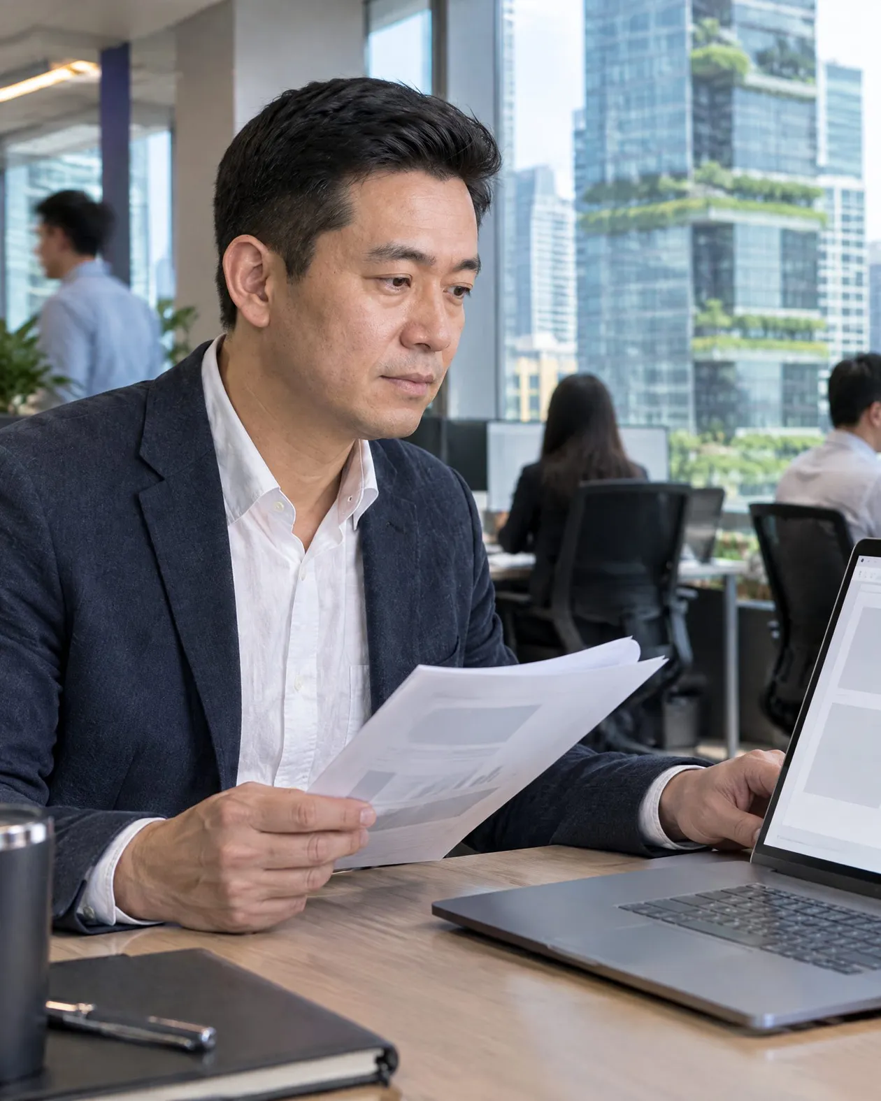 Analyst reviewing valuation and income figures